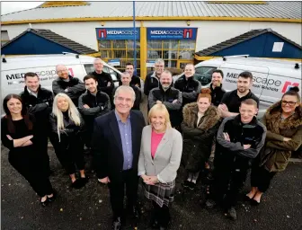  ??  ?? Mediascape staff, with Angus and Shona Knight, who set up the business in 2003 and have now transferre­d 80 per cent of the business to employees.