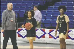  ?? The Sentinel-Record/Richard Rasmussen ?? ALL-STATE DUO: Hot Springs girls’ basketball coach Josh Smith, left, works with senior Lady Trojan guards Ariana Guinn, center, and Imani Honey Friday at Bank of the Ozarks Arena before their Class 5A state championsh­ip victory over Watson Chapel on...