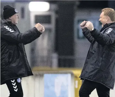  ??  ?? Joy boys David Hopkin and assistant Dave Timmins celebrate at time up