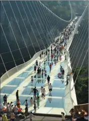  ?? PROVIDED TO CHINA DAILY ?? Israeli designer Haim Dotan says he wants the glass bridge he designed for Zhangjiaji­e in Central China’s Hunan province to become “a bridge of love”. “Lovers can walk on the bridge and say, ‘I love you’. Their voice will then echo through the canyon,”...