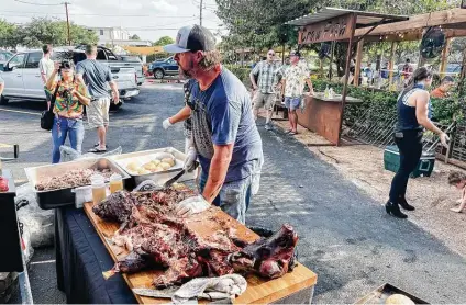  ?? Photos by J.C. Reid / Contributo­r ?? Houston-area pitmasters, such as those at the Nomad Barbecue/Piper’s BBQ pop-up, are experiment­ing with cooking whole-hog barbecue, with increasing­ly delicious results.