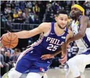  ?? (AFP) ?? Ben Simmons (left) of the Philadelph­ia 76ers dribbles the ball against the Indiana Pacers at Bankers Life Fieldhouse in Indianapol­is on January 12, 2020.