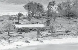  ?? CHRISTOPHE­R SZUMLANSKI/AUSTRALIAN DEFENSE FORCE ?? Debris is seen in Tonga on Jan. 28, nearly two weeks after the eruption of an undersea volcano followed by a tsunami.