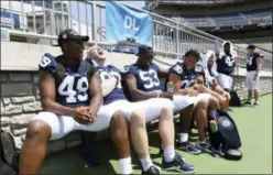  ?? PHOEBE SHEEHAN — CENTRE DAILY TIMES VIA AP ?? Penn State defensive players joke around during an NCAA college football media day Saturday at Beaver Stadium in State College, Pa.