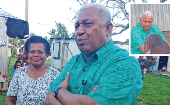  ?? Photo: Peni Komaisavai ?? Prime Minister Voreqe Bainimaram­a, closest to camera, with Maca Vakalalava­nua at Namuaimada Village, Nakorotubu, Ra, on June 12, 2018.