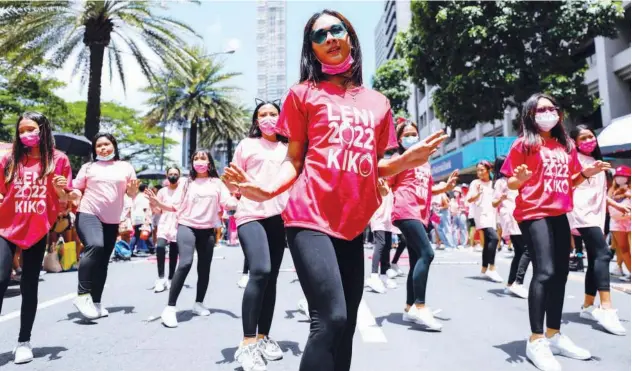  ?? Reuters ?? ↑
Supporters of Leni Robredo dance while taking part in a campaign rally in Metro Manila on Saturday.