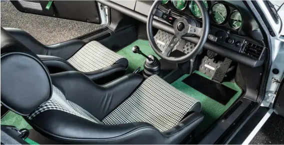  ??  ?? Below: Custom-woven houndstoot­h material is used for inserts in the leathertri­mmed, figure-hugging S/Tstyle seats. There’s a definite retro look, but the detailing and quality match that of any modern Porsche