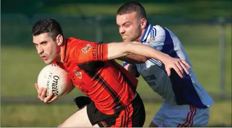  ?? Photo by Eric Barry ?? Duhallow’s Seamus Hickey gets in front of Seandun’s Gary Gould to win possession as the sides met in the County Senior Football Championsh­ip last weekend.