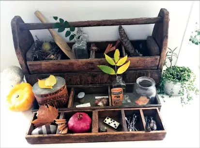  ?? Associated Press photo ?? This Sept. 21 photo provided by Katie Workman shows a “cabinet of curiositie­s,” with touches of Autumn, inside a home in New York. Fall is a great time to create a “cabinet of curiositie­s,” an idea that goes back centuries. You collect and display...