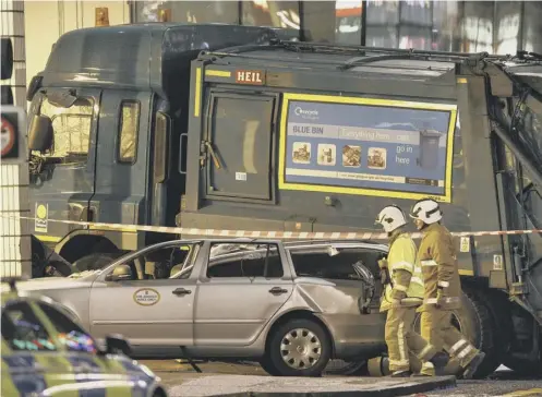  ??  ?? 0 The aftermath of the refuse bin lorry crash in George Square, Glasgow, which claimed the lives of six people in December, 2014