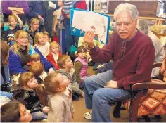  ?? ERIN HOOLEY/JOURNAL ?? New Mexico native Rudolfo Anaya reads “The Cat in the Hat” to a group of kids and parents at Bookworks in February 2007.