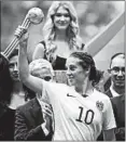  ?? ELAINE THOMPSON/AP ?? American Carli Lloyd took home the Golden Ball as MVP at the last World Cup, but this is a new years and team.