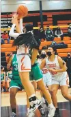  ?? ?? Madelynn Quintana shoots off the glass for the bucket on Monday (Feb. 7).