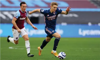  ??  ?? West Ham’s Mark Noble tries to catch Arsenal’s Martin Ødegaard during the 3-3 draw on Sunday. Photograph: Shaun Brooks/Action Plus/ Shuttersto­ck