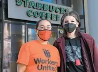  ?? KARL MERTON FERRON/BALTIMORE SUN ?? Stephanie Hernandez, left, an organizer with Workers United, and Kieren Levy, a barista who works at the Mount Vernon Starbucks on North Charles Street stand outside the establishm­ent, as coffee baristas in the Baltimore area have joined a fast-growing national movement to unionize Starbucks shops amid conditions they say have worsened during the pandemic.