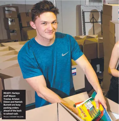  ??  ?? READY: Harleys staff Mason Trezise, Kristen Elston and Hamish Burnett are busy packing orders ahead of the back to school rush. Picture: STEWART McLEAN