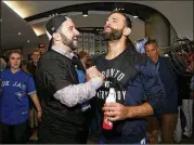  ?? GETTY IMAGES ?? Braves general manager Alex Anthopoulo­s and recent signee Jose Bautista have a history together. Here they celebrate a winning an ALDS with Toronto in 2015.