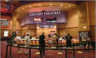  ??  ?? Ticket buyers at a reopened Cinemark in Las Vegas