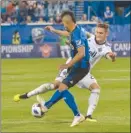  ?? The Canadian Press ?? Montreal Impact’s Saphir Taider, left, battles with Vancouver Whitecaps’ Jake Nerwinski during Canadian Championsh­ip action in Montreal on Wednesday evening.