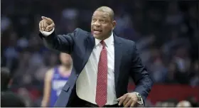  ?? THE ASSOCIATED PRESS FILE ?? Clippers head coach Doc Rivers talks to his players during a game against the Timberwolv­es in Los Angeles.