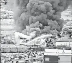  ?? CP PHOTO ?? A fire burns at a Northmart store in Iqaluit, Nunavut on Thursday, Nov. 8.