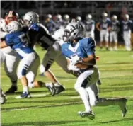  ?? PETE BANNAN — DIGITAL FIRST MEDIA ?? Malvern Prep’s Quincy Watson (9) tries to make the corner against Imhotep in the third quarter Friday night.