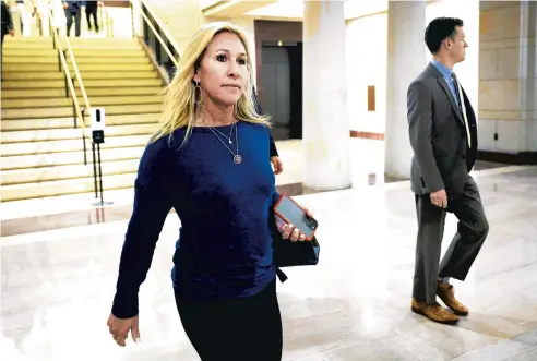  ?? KEVIN DIETSCH/GETTY ?? U.S. Rep. Marjorie Taylor Greene, R-Ga., arrives for a Republican caucus forum Wednesday to replace outgoing conference chair, Rep. Liz Cheney, R-Wyo.