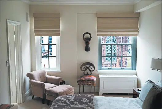  ?? ADAM DICARLO/CAROLYN DICARLO ?? A bedroom created by interior designer Carolyn DiCarlo uses soft colors and features a cozy reading chair by the window.