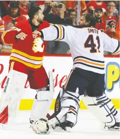  ?? GAVIN YOUNG / FILES ?? Calgary’s Cam Talbot, left, and Edmonton’s Mike Smith were the last goalies to fight each other in the NHL when they tussled on Feb. 1, 2020.