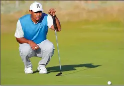  ?? RICHARD SELLERS/TRIBUNE NEWS SERVICE ?? Tiger Woods lines up a putt on the 15th during day one of The Open Championsh­ip 2018 on Thursday at Carnoustie Golf Links, Angus, Scotland.