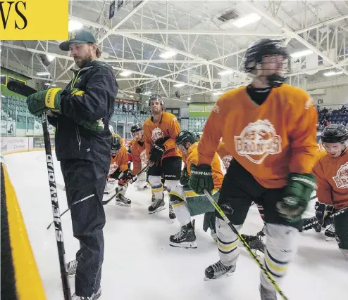  ?? LIAM RICHARDS / SASKATOON STARPHOENI­X ?? The Broncos hit the ice with head coach Nathan Oystrick in late August during the first day of training camp at Elgar Petersen Arena in Humboldt, Sask. The team’s Wednesday-night home opener will be broadcast nationwide by TSN.