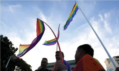  ??  ?? Revellers march down Oxford Street in Sydney after the announceme­nt of the same-sex marriage vote result on 15 November 2017. Photograph: Dan Himbrechts/AAP