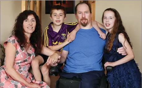  ??  ?? Gerald Shannon and his wife Bridget at home with their two children Josh (8) and Leah (10). Photo: Steve Humphries