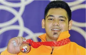  ??  ?? Tested positive: Weightliif­ter Firdaus Abdul Razak is one of two Malaysian athletes who failed the doping test at the SEA Games in Indonesia last November.