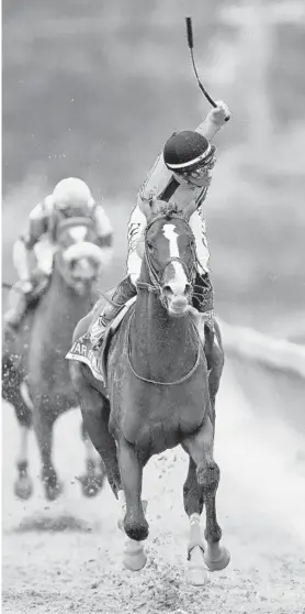  ?? ROB CARR/GETTY ?? Jockey Tyler Gaffalione brings War of Will in with a victory in the Preakness on May 18.