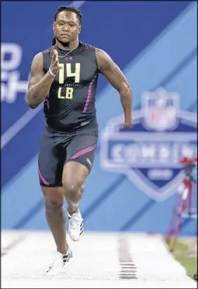  ?? AP PHOTO ?? Central Florida linebacker Shaq Griffin runs the 40-yard dash at the NFL football scouting combine in Indianapol­is on Sunday.