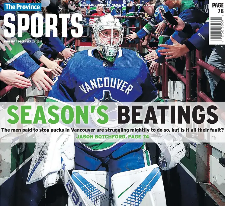  ?? — GETTY IMAGES FILES ?? Fans pat Jacob Markstrom on the back as he enters Rogers Arena. Rivals’ pucks have also been getting behind Markstrom and teammate Anders Nilsson.