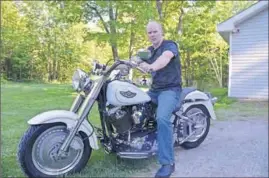  ?? KIRK STARRATT ?? Devil’s Half Acre Motorcycle Event organizer Harlon Wood sits on his Harley Davidson. He hopes the rally will draw thousands of motorcycli­sts and enthusiast­s to Kentville’s downtown core.