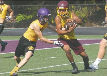  ?? The Sentinel-Record/Richard Rasmussen ?? SUMMER MATCHUP: Lake Hamilton’s Cam’ron Rains, right, catches a pass as Fountain Lake’s Brayden Branstette­r defends Friday during the Allen Tillery Auto/Fountain Lake 7-on-7 Tournament.