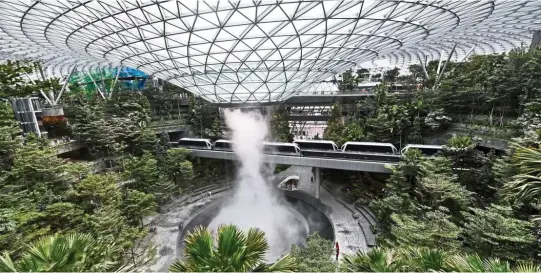  ??  ?? Ample savings: A file picture showing the Rain Vortex in the Changi Jewel Airport. Singapore is a model to emulate in implementi­ng a sound reserves management strategy. — AFP