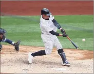  ?? Al Bello / Getty Images ?? The Yankees’ Gary Sanchez connects for a two-run home run on Thursday against the Blue Jays.