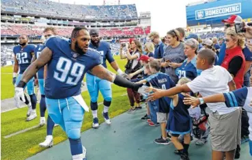  ?? THE ASSOCIATED PRESS ?? Tennessee Titans defensive end Jurrell Casey greets fans before last Sunday’s home game against the Baltimore Ravens.