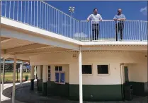  ?? SARAH PETERS / THE PALM BEACH POST ?? Deputy Leisure Services Administra­tor Daniel Prieto and Parks and Grounds Operations Manager Cory Wilder stand atop the new scoring structure that the city has added to the baseball complex at Gardens Park on Burns Road.