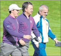  ??  ?? Rory Mcilroy, Graeme Mcdowell and Paul Mcginley at Gleneagles in 2014