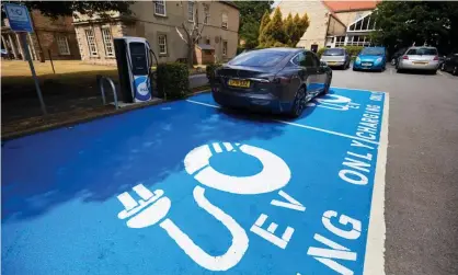  ?? Photograph: Christophe­r Thomond/for the Guardian ?? Labour and the Tories have promised to boost electric car infrastruc­ture.