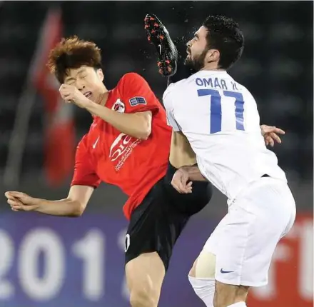  ?? AFP PIC ?? Al Rayyan’s Myong-Jin Ko (left) and Al Hilal’s Omar Khribin tussle for the ball in their AFC Champions League Group D match in Doha on Monday.