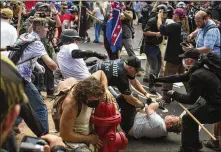  ?? MATT EICH / THE NEW YORK TIMES ?? Fighting filled the streets of Charlottes­ville, Va., where white nationalis­ts faced counter protesters at a planned protest Saturday. The demonstrat­ion turned violent almost immediatel­y, leaving at least one dead.