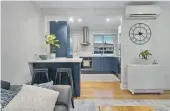  ?? HARCOURTS ?? The blue tones in the renovated kitchen of this Linwood home add a calming touch.