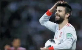  ?? MANU FERNANDEZ — THE ASSOCIATED PRESS ?? Spain’s Gerard Pique holds the ball during the group B match between Iran and Spain at the 2018 soccer World Cup in the Kazan Arena in Kazan, Russia, Wednesday.