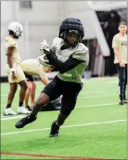  ?? CU ATHLETICS ?? Colorado’s Travis Hunter runs with the ball during spring practice in Boulder on Monday.